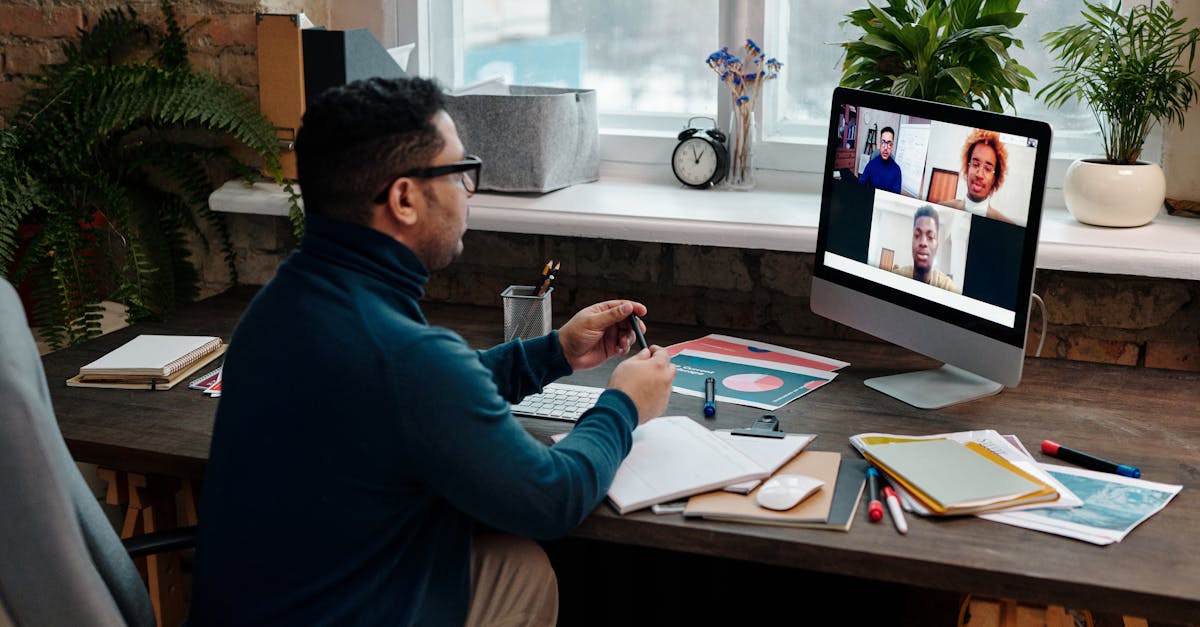 Man engaging in an online meeting from home office, showcasing remote work dynamics.